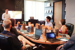 Employees in board room meeting