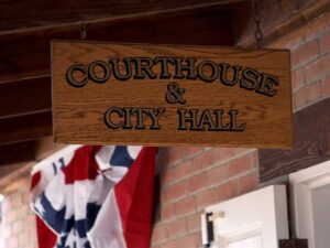 courthouse and city hall wooden sign