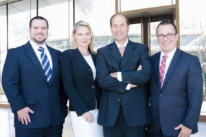 The Lynch Law Group leadership team includes Attorneys Dan Lynch, Charles Hadad, Krista Kochosky