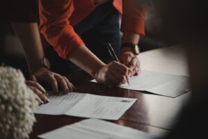 Couple signing estate planning documents