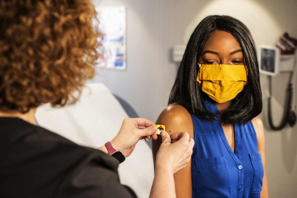 woman receiving covid-19 vaccine