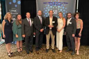 The Lynch Law Group attorneys pose with award at 2021 Fast 50 Awards