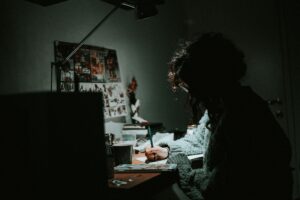 artist at work in low light